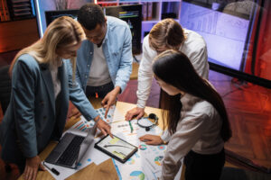 A group of professionals gather around a table to discuss their DRP